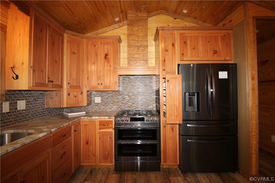 232 Perkins Mill Road Dillwyn, VA 23936 - Photo 11 of 48 a kitchen with a refrigerator and cabinets