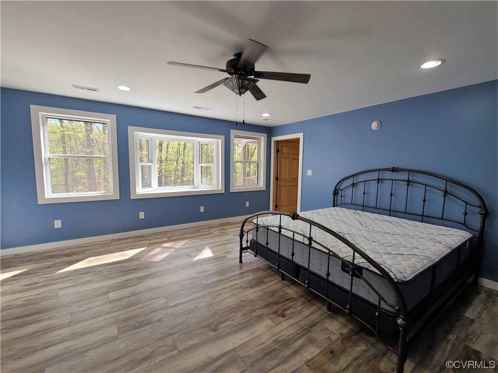 232 Perkins Mill Road Dillwyn, VA 23936 - Photo 17 of 48 a spacious bedroom with a bed a window and dresser