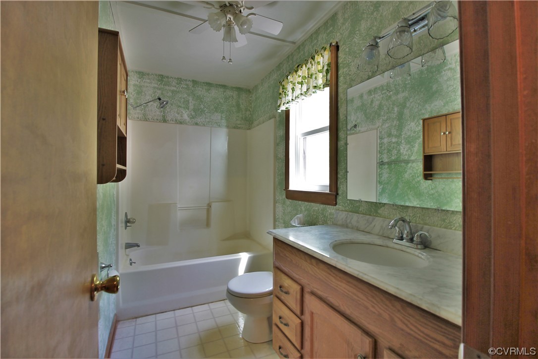 232 Perkins Mill Road Dillwyn, VA 23936 - Photo 29 of 48 a bathroom with a granite countertop sink toilet and shower