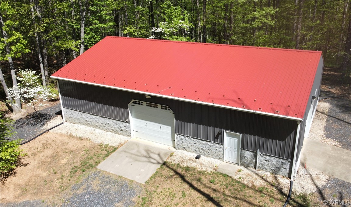 232 Perkins Mill Road Dillwyn, VA 23936 - Photo 42 of 48 a backyard of a house with yard and outdoor seating