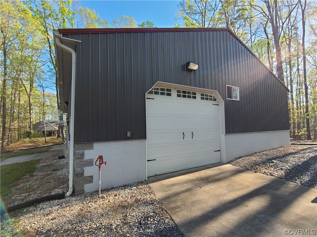 232 Perkins Mill Road Dillwyn, VA 23936 - Photo 43 of 48 a front view of a house with a garage