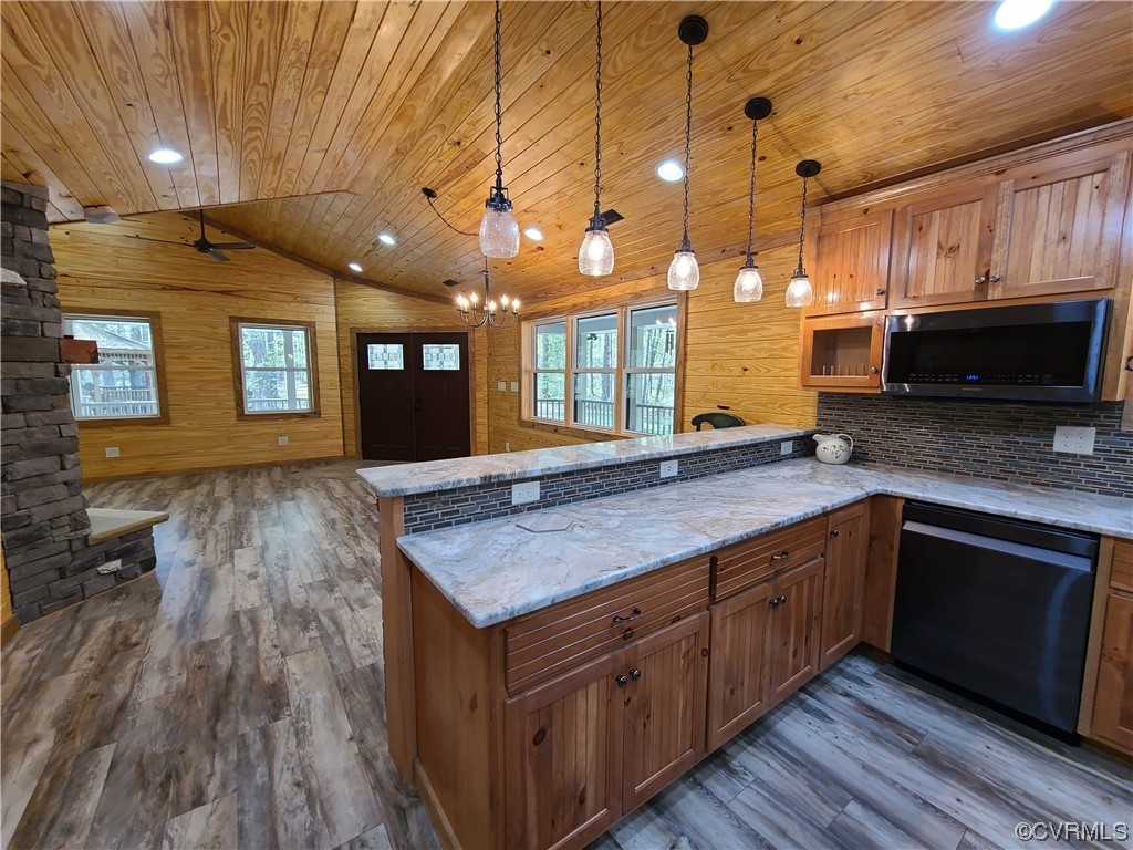 232 Perkins Mill Road Dillwyn, VA 23936 - Photo 9 of 48 a kitchen with a wooden floor and front view of a house