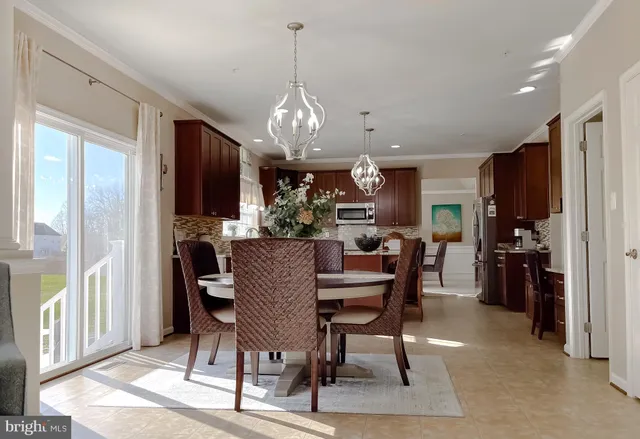 a kitchen with granite countertop a stove a sink and a microwave