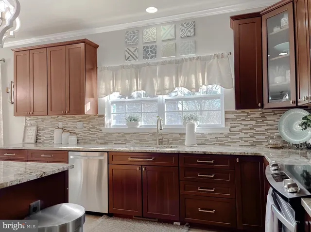 a view of a hallway with windows and stairs