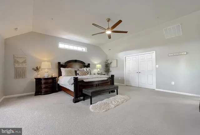 a bedroom with a bed and a view of bedroom