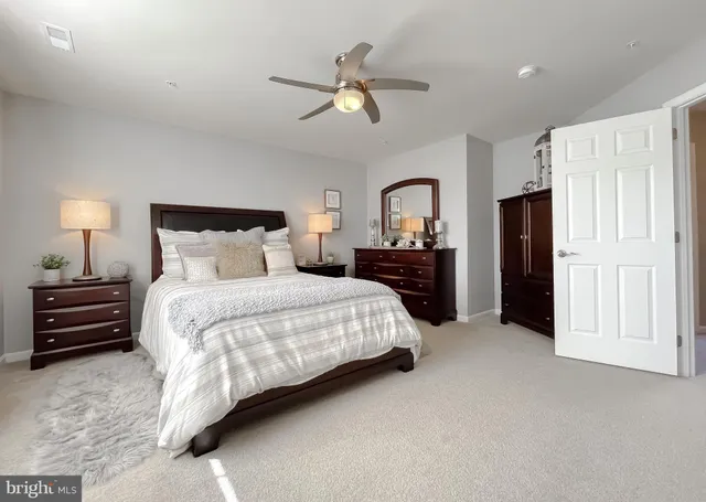 an aerial view of multiple houses with yard