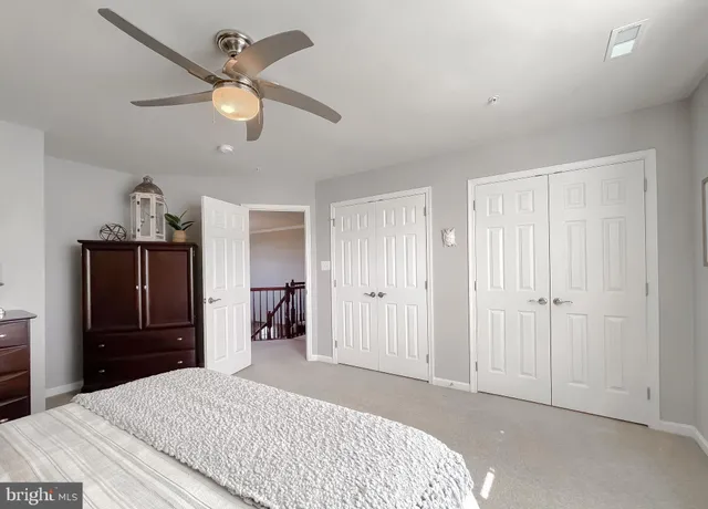 a front view of a house with swimming pool having outdoor seating