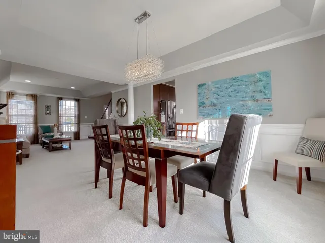 a living room with furniture large window and a fireplace