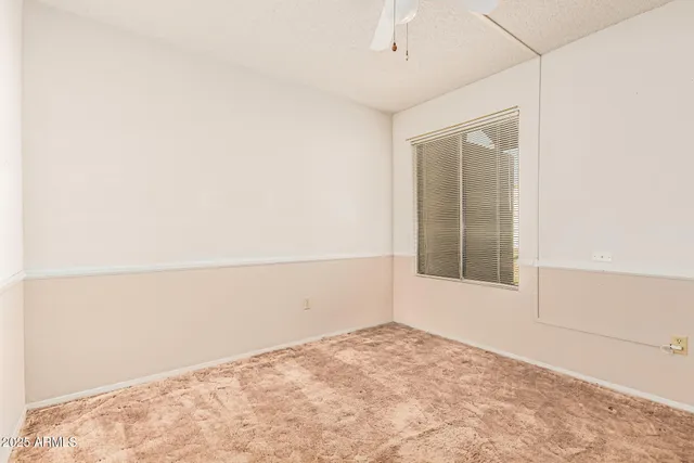 a view of a livingroom with a ceiling fan