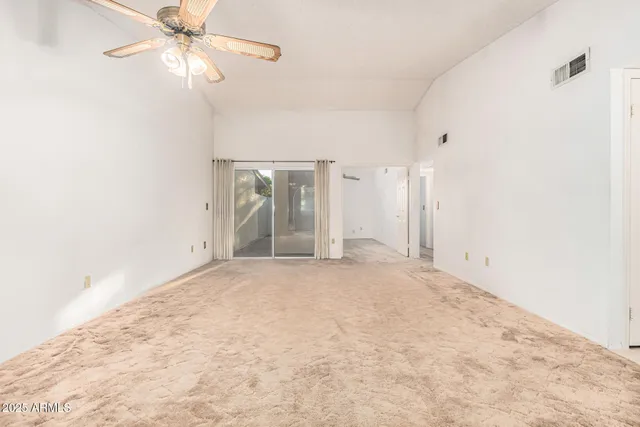 a kitchen with a sink a window cabinets and stainless steel appliances