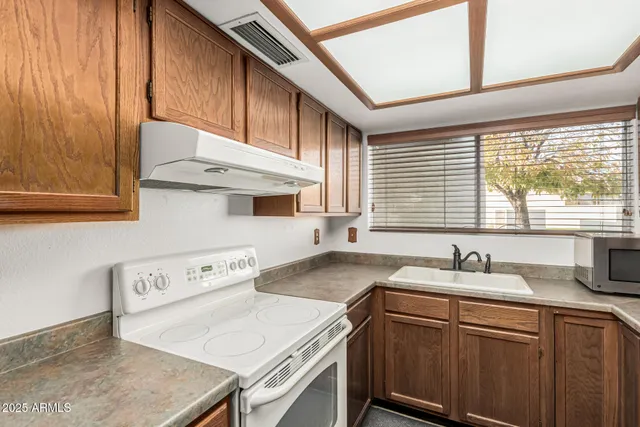 a view of storage and utility room with washer and dryer