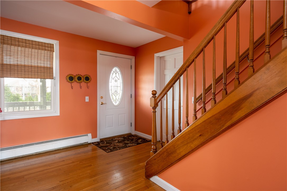 459 Wapping Road Portsmouth, RI 02871 - Photo 8 of 38 Front entrance to the main house is straight ahead, the entrance to additional space is to the right of the stairs