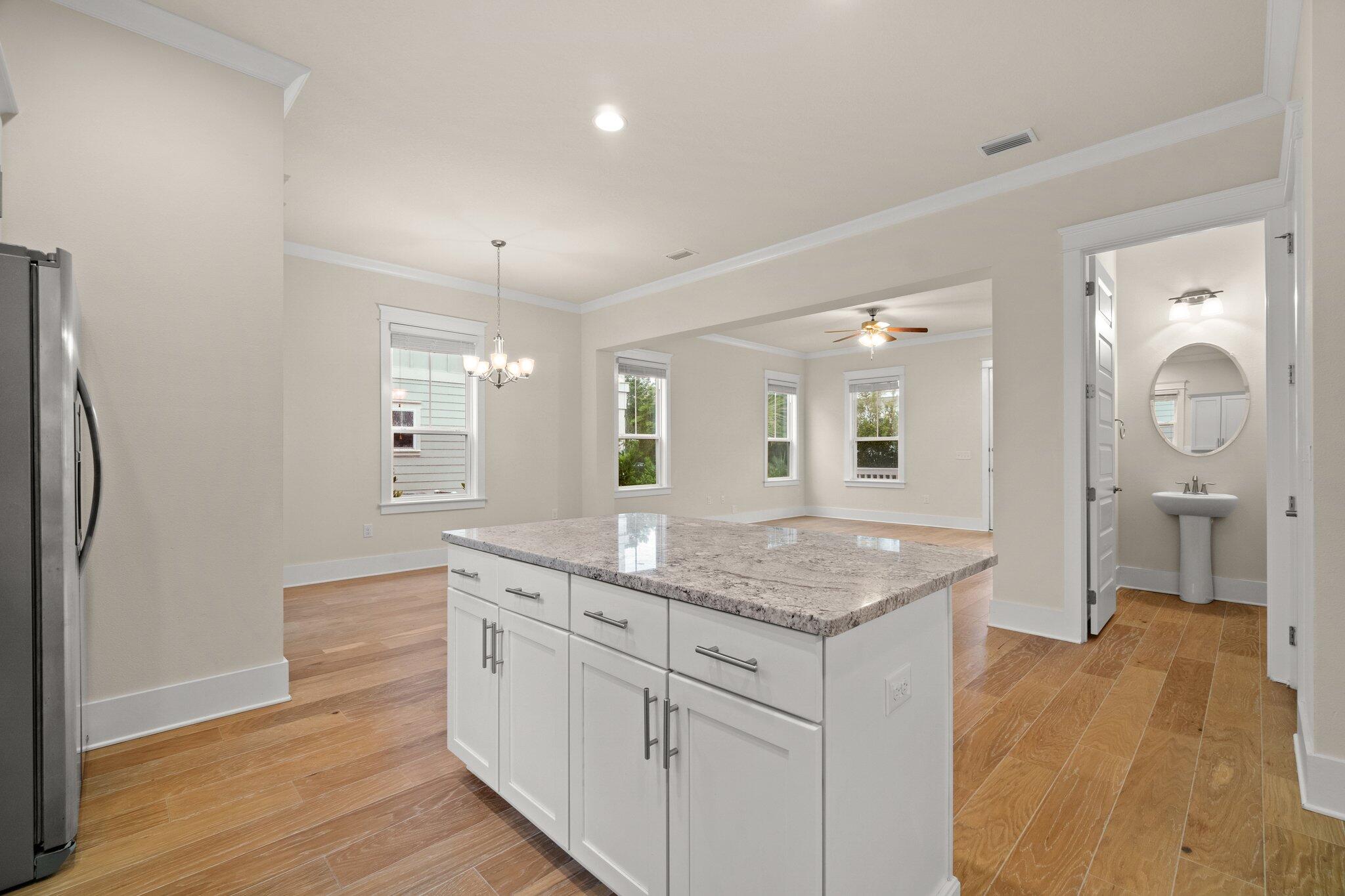 99 Grande Pointe Circle Inlet Beach, FL 32461 - Photo 11 of 34 a hallway with sink and mirror