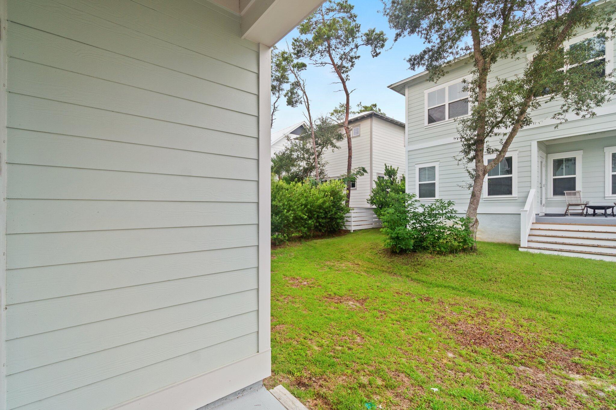 99 Grande Pointe Circle Inlet Beach, FL 32461 - Photo 12 of 34 a view of a house with a backyard