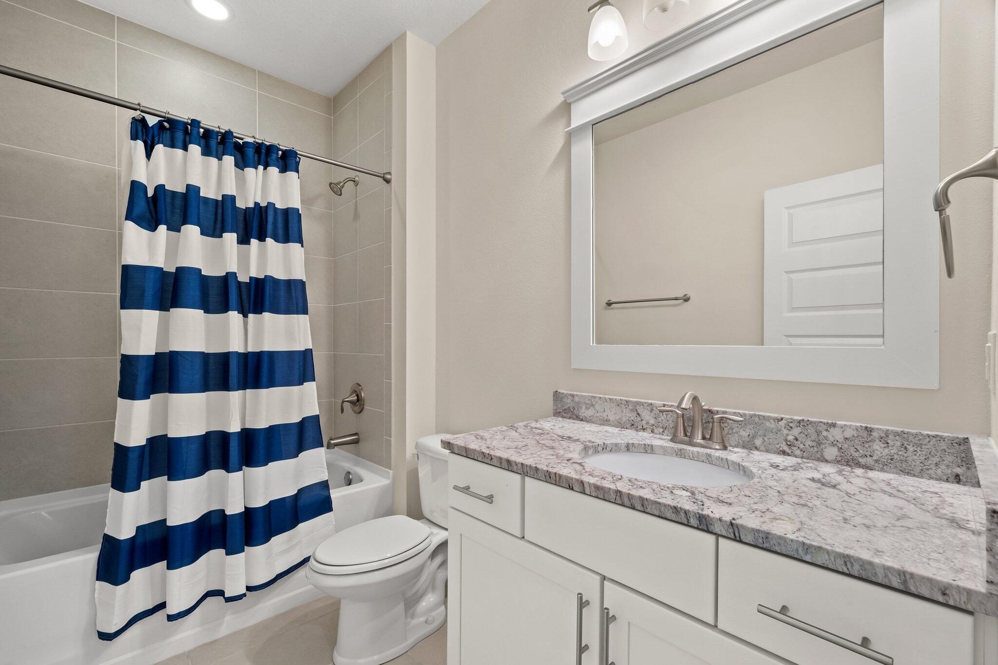 99 Grande Pointe Circle Inlet Beach, FL 32461 - Photo 18 of 34 a bathroom with a sink a toilet a shower and a mirror