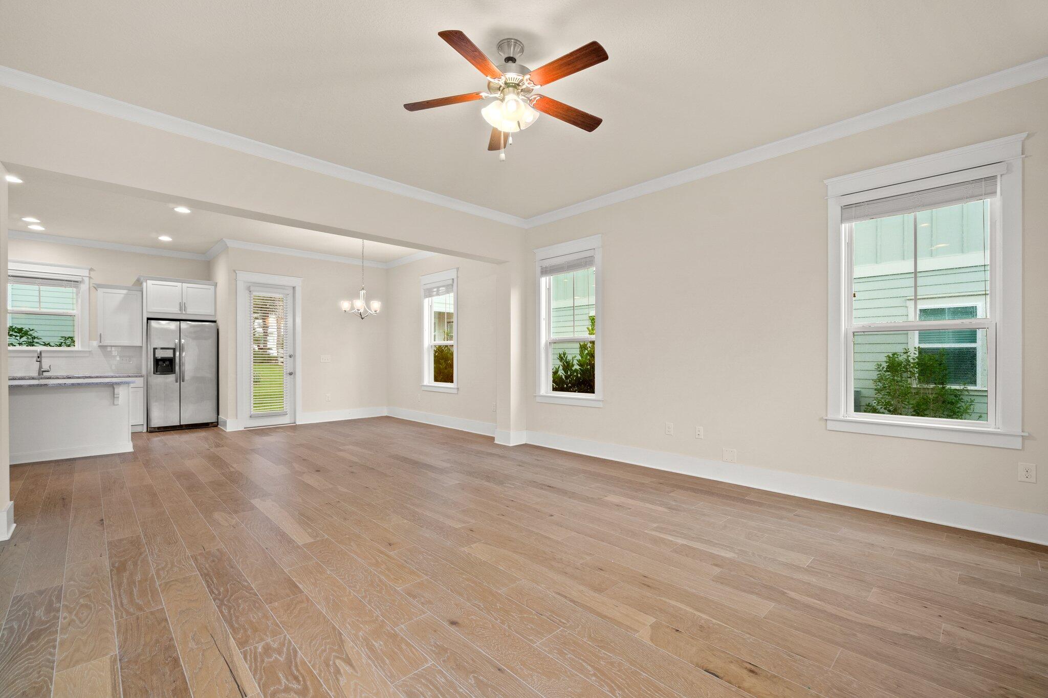 99 Grande Pointe Circle Inlet Beach, FL 32461 - Photo 5 of 34 a view of an empty room with window and wooden floor