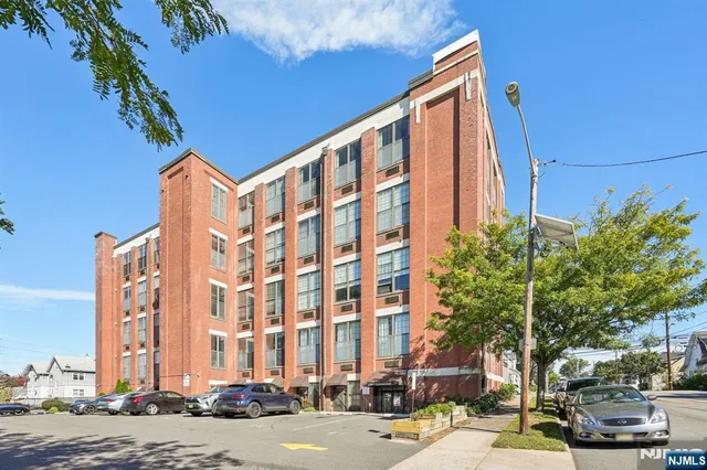 a front view of a building with street view