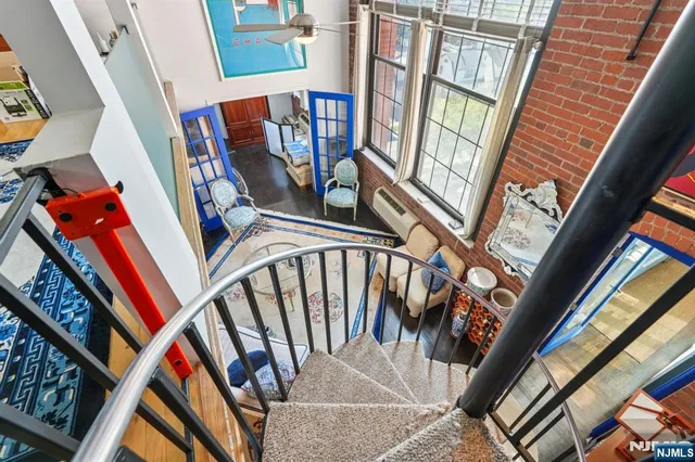 a bedroom with bed and wooden floor