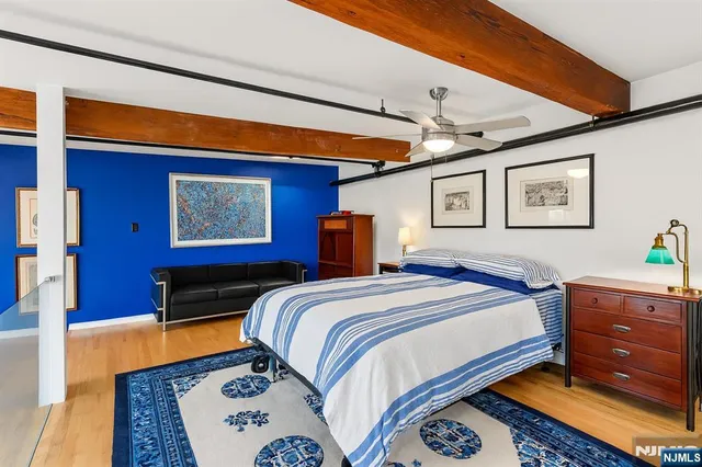 a bed room with a bed and a television