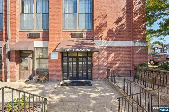 a outdoor space with patio the couches and a dining table with wooden floor