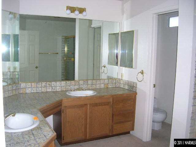 2370 High Terrace Drive Reno, NV 89509 - Photo 9 of 13 a bathroom with a sink toilet and shower