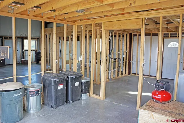 a bathroom with a toilet a sink and a window