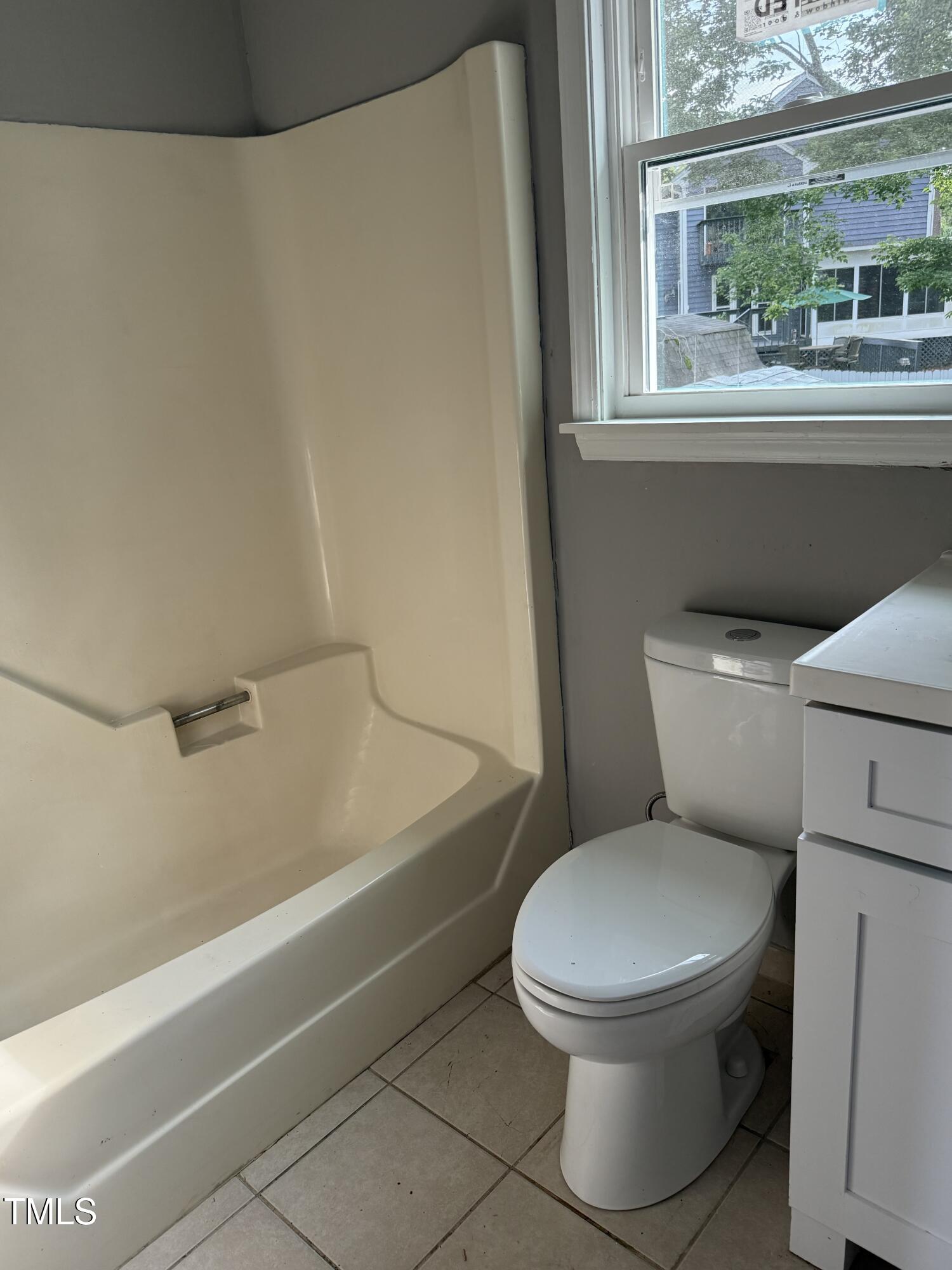3825 Old Coach Road Raleigh, NC 27616 - Photo 18 of 31 a white toilet sitting next to a window