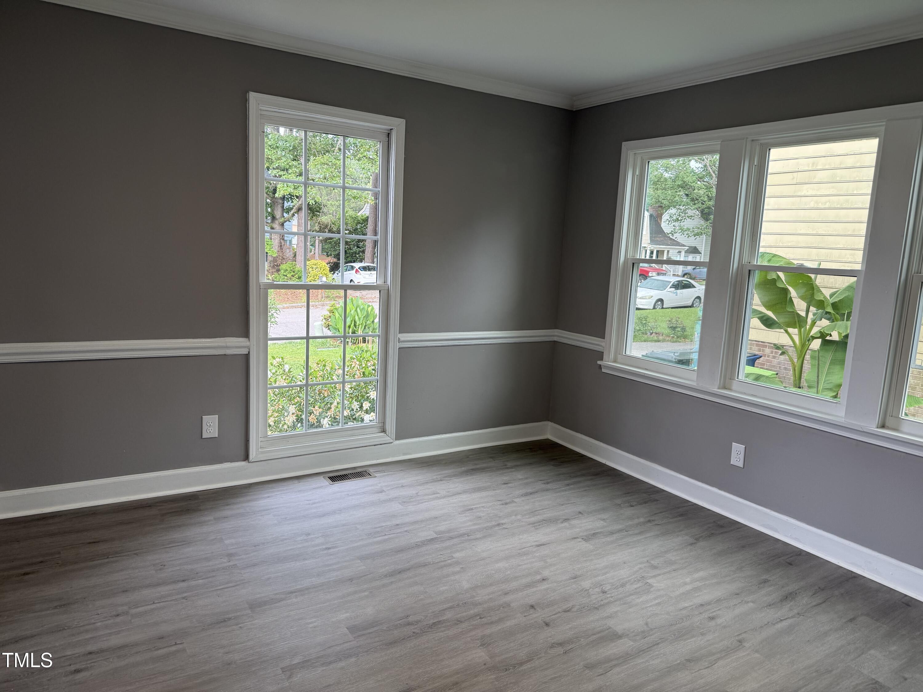 3825 Old Coach Road Raleigh, NC 27616 - Photo 10 of 31 a view of an empty room with wooden floor and a window