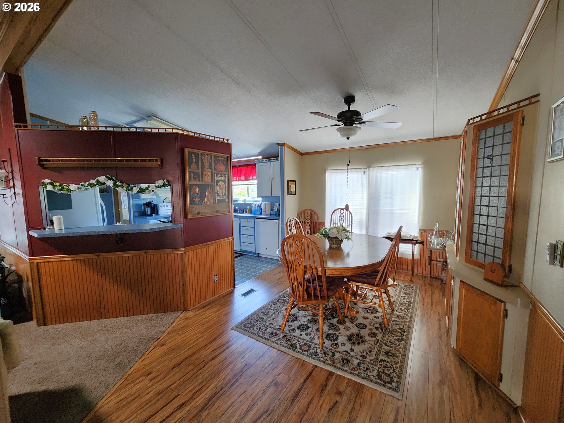 5422 Portland Road Northeast Salem, OR 97305 - Photo 7 of 14 a view of a dining room with furniture window and wooden floor