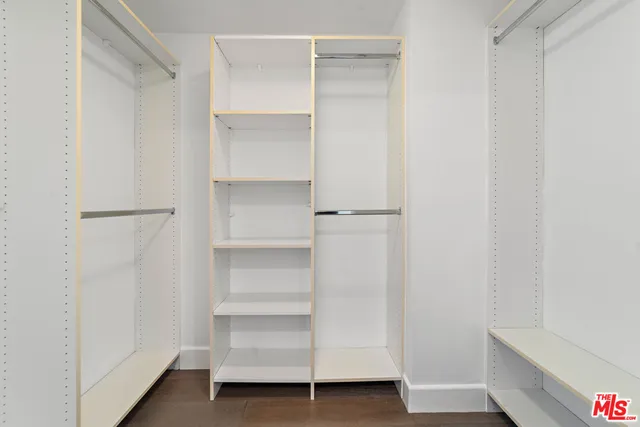 a utility room with cabinets washer and dryer