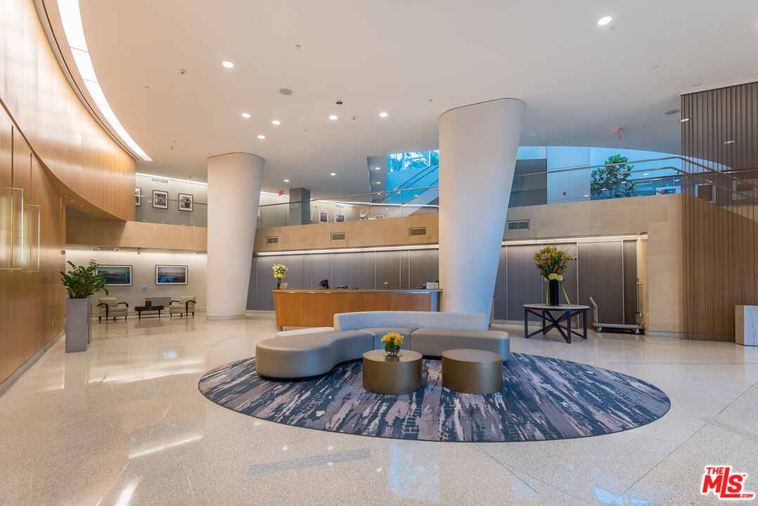 13600 Marina Pointe Drive, Unit 1904 Marina del Rey, CA 90292 - Photo 32 of 57 a living room with furniture and kitchen view