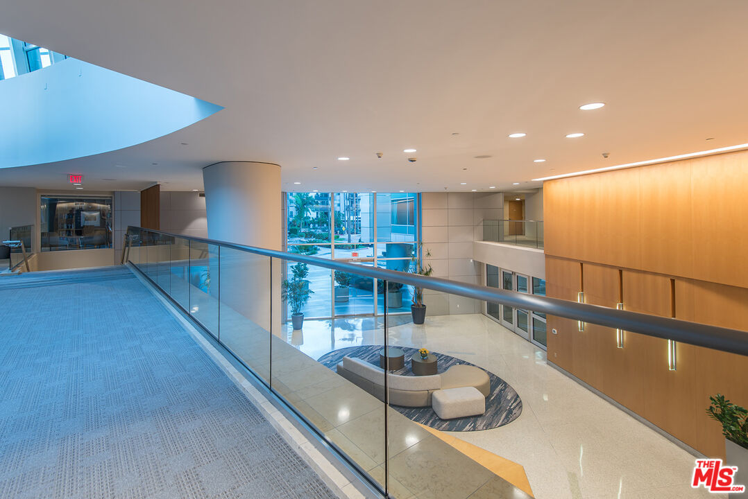 13600 Marina Pointe Drive, Unit 1904 Marina del Rey, CA 90292 - Photo 41 of 57 a kitchen with stainless steel appliances granite countertop a sink and a wooden floors