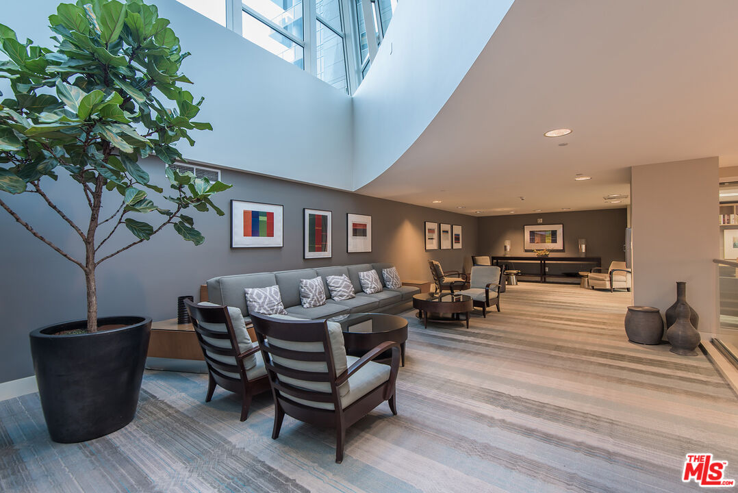 13600 Marina Pointe Drive, Unit 1904 Marina del Rey, CA 90292 - Photo 44 of 57 a living room with furniture and a potted plant