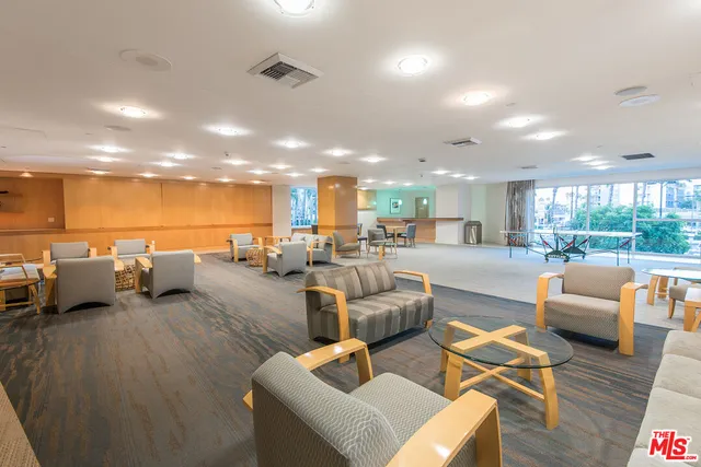 a view of a swimming pool with outdoor seating