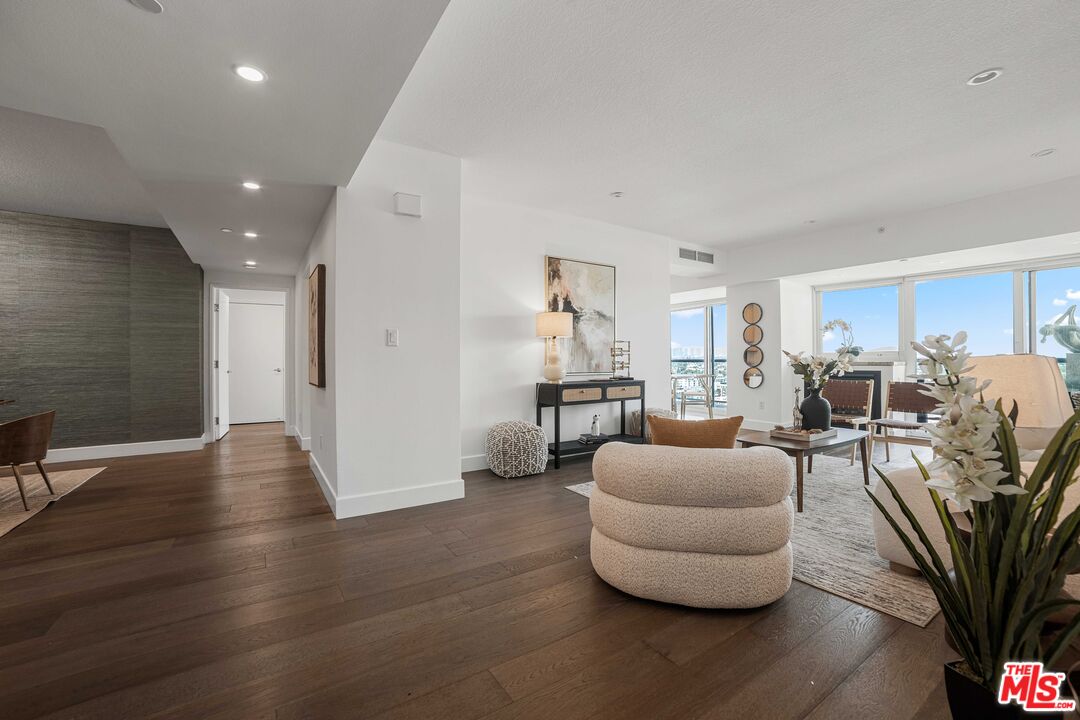13600 Marina Pointe Drive, Unit 1904 Marina del Rey, CA 90292 - Photo 5 of 57 a living room with furniture and a wooden floor