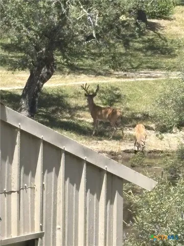 a view of balcony with wooden floor
