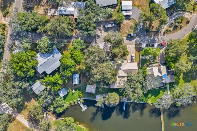 an aerial view of house with yard swimming pool and outdoor seating