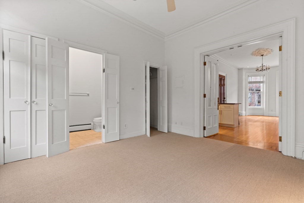 103 Appleton Street, Unit 3 Boston, MA 02116 - Photo 7 of 11 a view of a big room with closet and windows