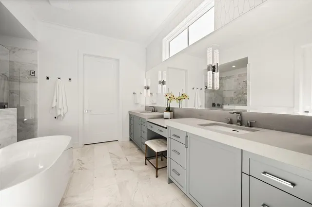 a spacious bathroom with a sink a toilet and shower