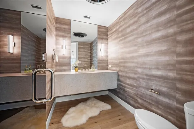 a bathroom with a toilet and a sink