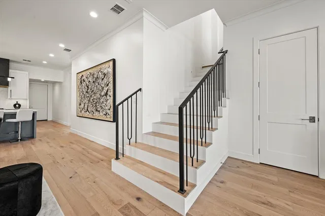 a view of a hallway with stairs