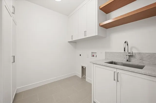 a kitchen with a sink and cabinets