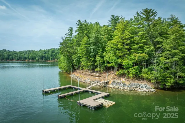 a view of a lake with a house in the background