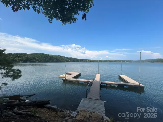 a view of a lake with outdoor seating