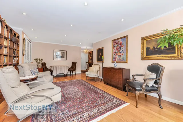 a living room with furniture or couch and a wooden floor