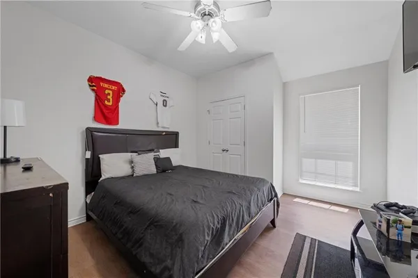 a bedroom with a bed and window