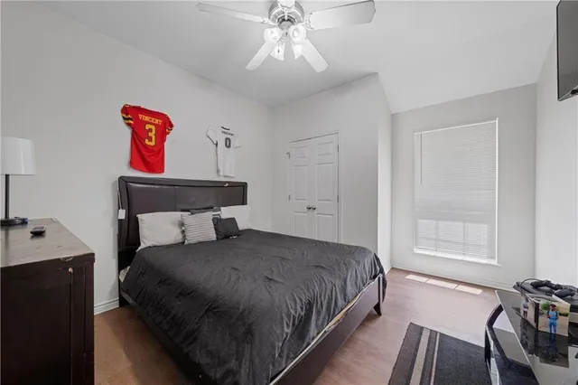 a bedroom with a bed and window