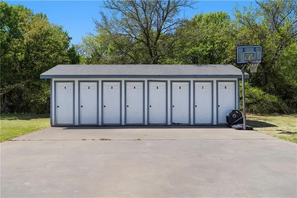 a view of a house with a yard and fence