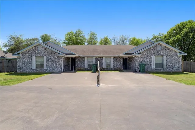 a house with trees in the background