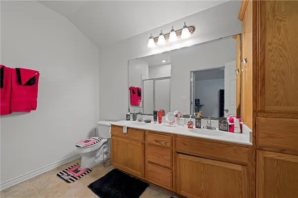 a bathroom with a sink vanity and a mirror